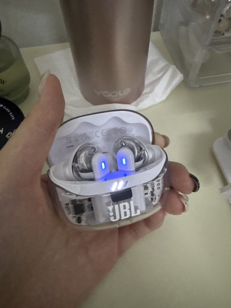 JBL True Wireless Earbuds with Charging Case (Category: Earphones) located in Puchong. Submitted by yichervely (Listing ID 1449461048, Image 2). Description: - JBL True Wireless Earbuds - Comes with a clear charging case - Blue indicator lights show when earbuds are charging - Distinct JBL logo visible on both the case and earbuds - Enjoy great sound quality.