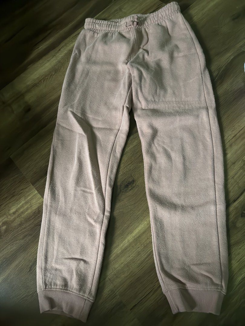 Kids Joggers Sweatpants Bundle (Pink & Green) (Category: Babies & Kids Fashion) located in Valenzuela. Submitted by divine0916 (Listing ID 1449342943, Image 1). Description: - Bundle of two pairs of kids' pants. - One pair: Light pink jogger style with drawstring waist and cuffed ankles. - Second pair: Muted green pants with drawstring waist and cuffed ankles. - Comfortable for everyday wear, playtime, and lounging..