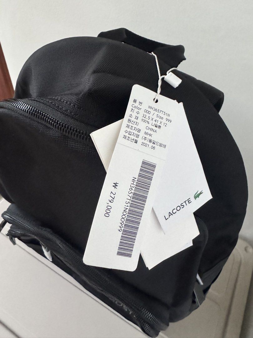Lacoste Black Backpack NH3657T51N (Category: Backpacks) located in Bulacan. Submitted by jodayyyyyy (Listing ID 1449410609, Image 2). Description: - Authentic Lacoste backpack, brand new with original tags. - Multiple zippered compartments for organized storage. - Main compartment features a vibrant yellow lining. - Padded back and mesh straps for enhanced comfort. -.
