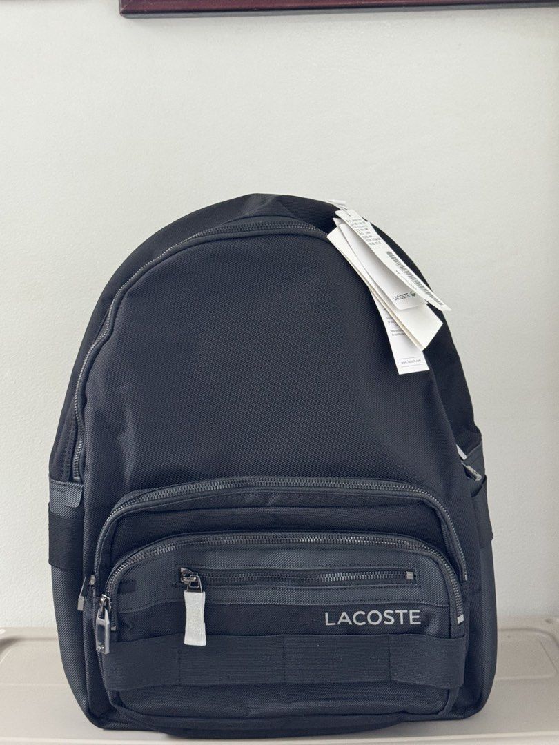 Lacoste Black Backpack NH3657T51N (Category: Backpacks) located in Bulacan. Submitted by jodayyyyyy (Listing ID 1449410609, Image 1). Description: - Authentic Lacoste backpack, brand new with original tags. - Multiple zippered compartments for organized storage. - Main compartment features a vibrant yellow lining. - Padded back and mesh straps for enhanced comfort. -.