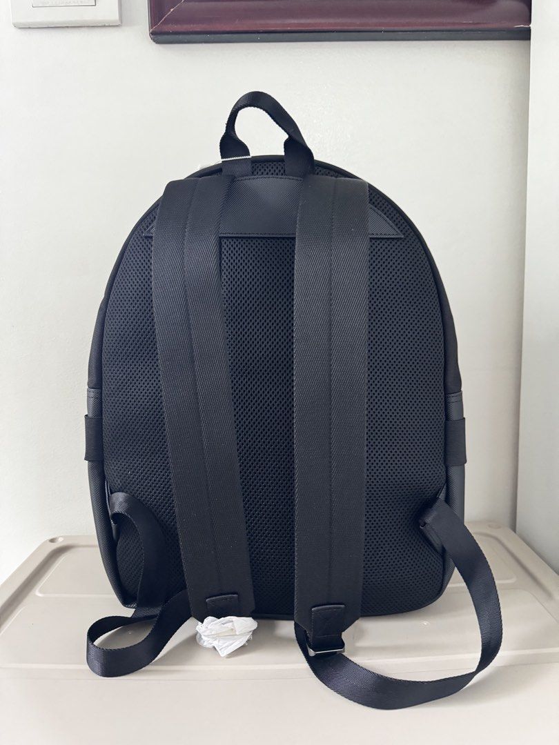 Lacoste Black Backpack NH3657T51N (Category: Backpacks) located in Bulacan. Submitted by jodayyyyyy (Listing ID 1449410609, Image 3). Description: - Authentic Lacoste backpack, brand new with original tags. - Multiple zippered compartments for organized storage. - Main compartment features a vibrant yellow lining. - Padded back and mesh straps for enhanced comfort. -.