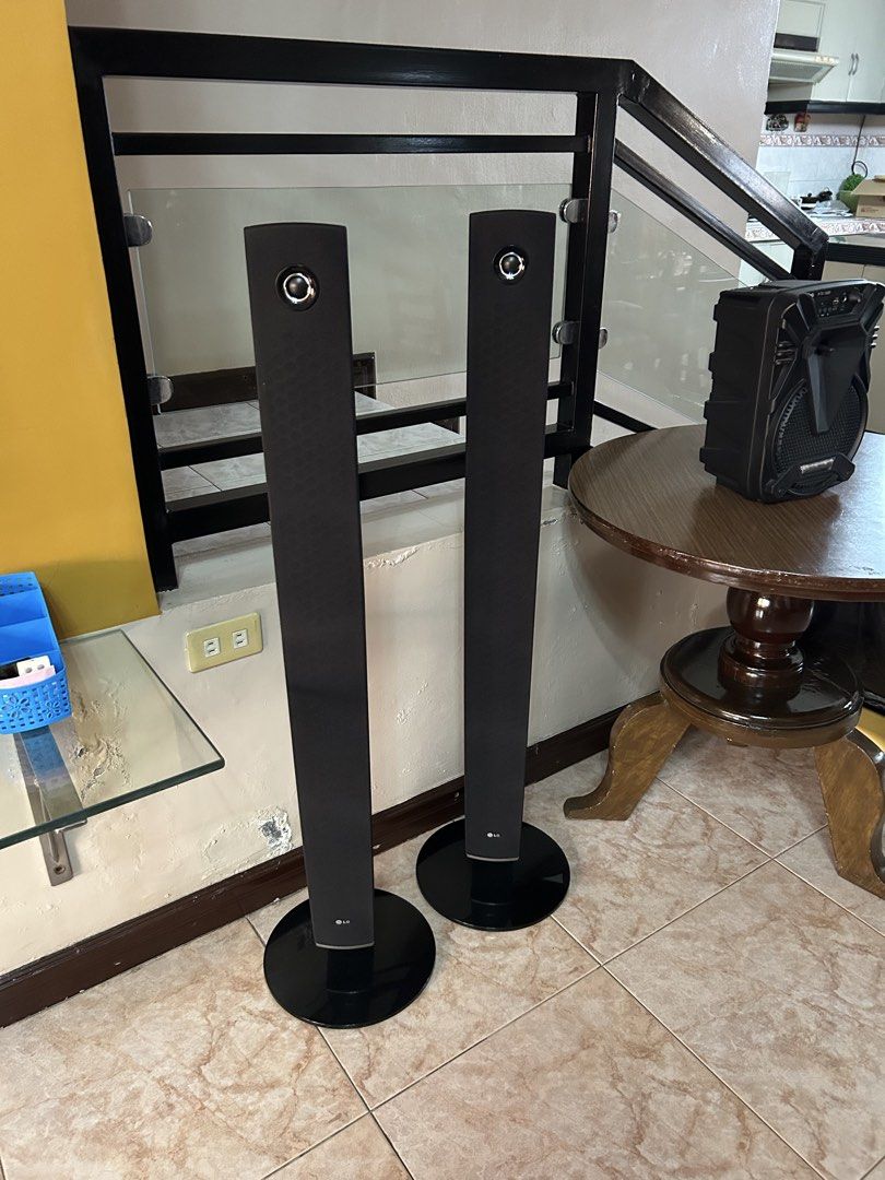 LG Tower Speakers 4 pcs. (Category: Soundbars, Speakers & Amplifiers) located in Imus. Submitted by drj37ilas (Listing ID 1449328544, Image 2). Description: - Sleek, modern LG tall speakers - Black fabric covers with silver top accent - Circular base design - Ideal for home theater or sound system upgrade.
