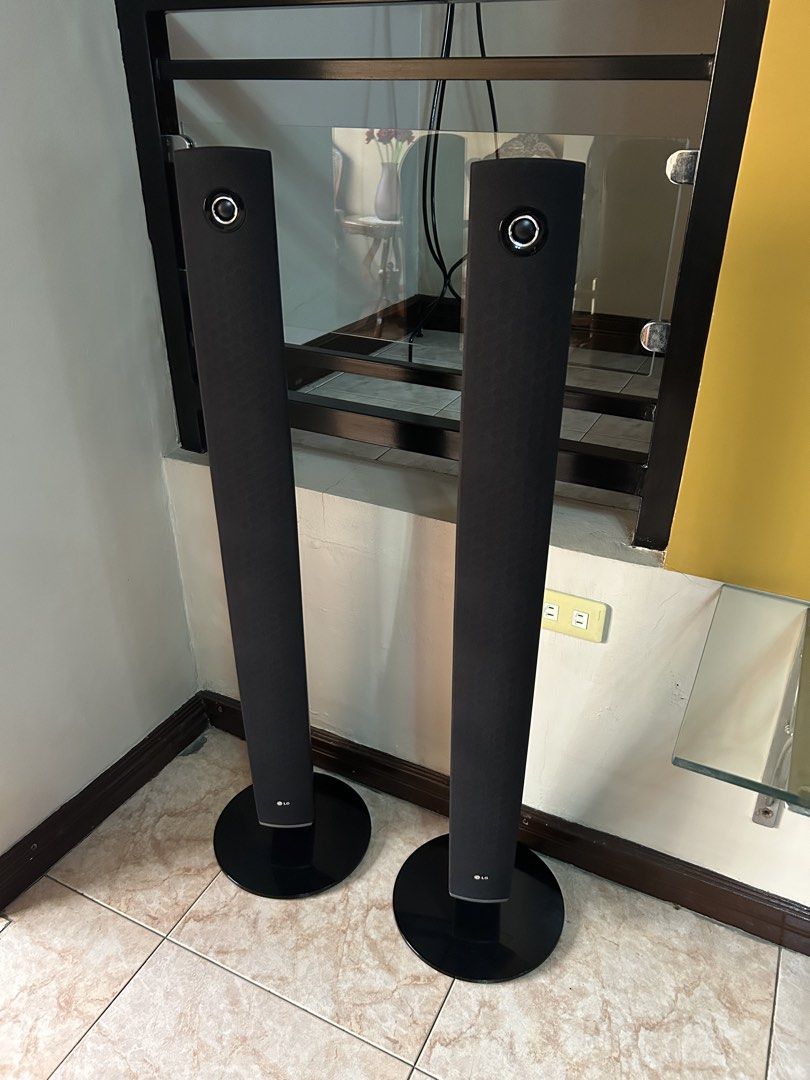 LG Tower Speakers 4 pcs. (Category: Soundbars, Speakers & Amplifiers) located in Imus. Submitted by drj37ilas (Listing ID 1449328544, Image 1). Description: - Sleek, modern LG tall speakers - Black fabric covers with silver top accent - Circular base design - Ideal for home theater or sound system upgrade.