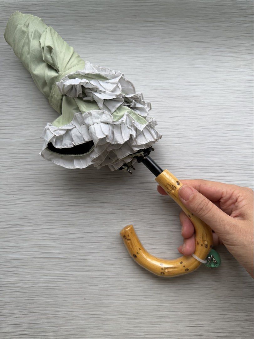 Light Green White Ruffles Wood Handle Folding Umbrella (Category: Umbrellas) located in Quezon City. Submitted by shopgood_mnl (Listing ID 1449397231, Image 2). Description: .
