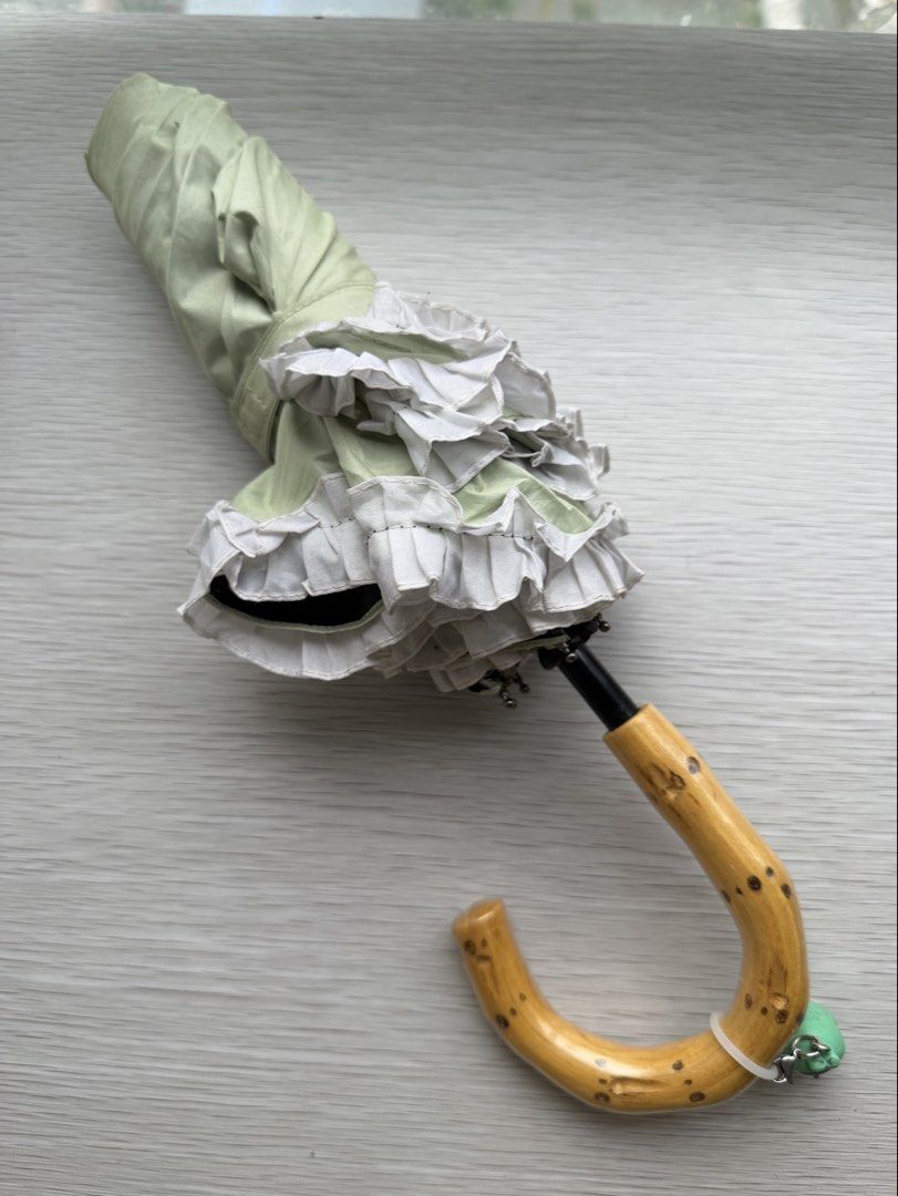 Light Green White Ruffles Wood Handle Folding Umbrella (Category: Umbrellas) located in Quezon City. Submitted by shopgood_mnl (Listing ID 1449397231, Image 1). Description: .