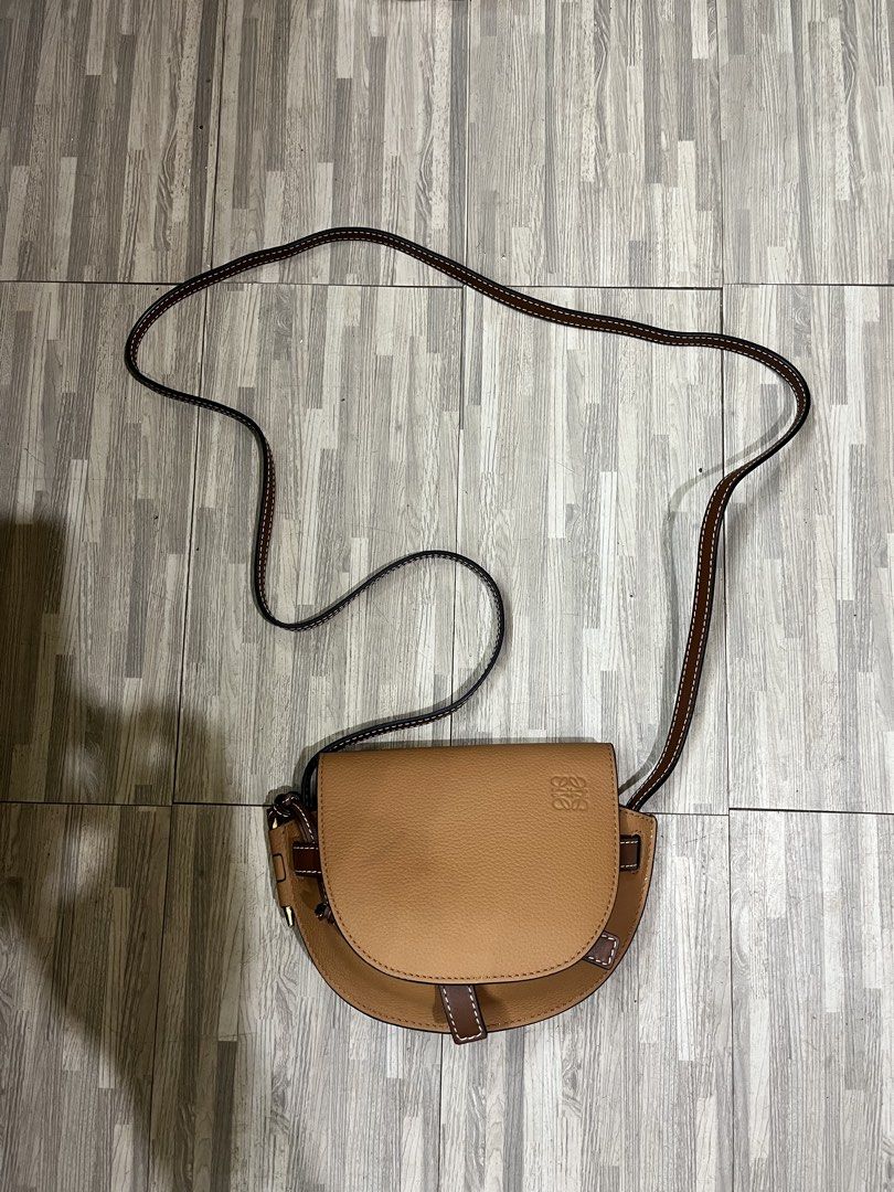 Loewe Gate Dual Mini Bag (Category: Luxury Bags & Wallets) located in Zamboanga. Submitted by alterramz08 (Listing ID 1449481040, Image 2). Description: This Loewe Gate Dual Mini Bag features a distinct tan calfskin body contrasted by a dark brown leather front tie fastening. Excellent Condition Price :15k.