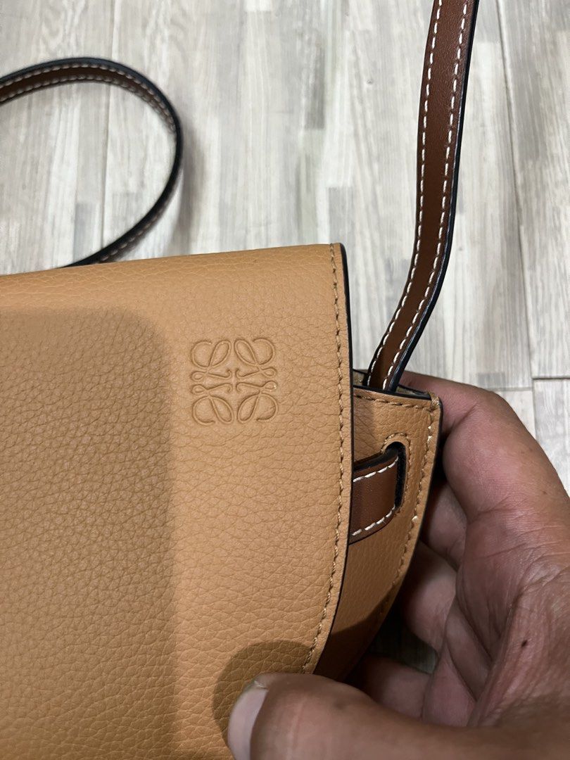 Loewe Gate Dual Mini Bag (Category: Luxury Bags & Wallets) located in Zamboanga. Submitted by alterramz08 (Listing ID 1449481040, Image 3). Description: This Loewe Gate Dual Mini Bag features a distinct tan calfskin body contrasted by a dark brown leather front tie fastening. Excellent Condition Price :15k.