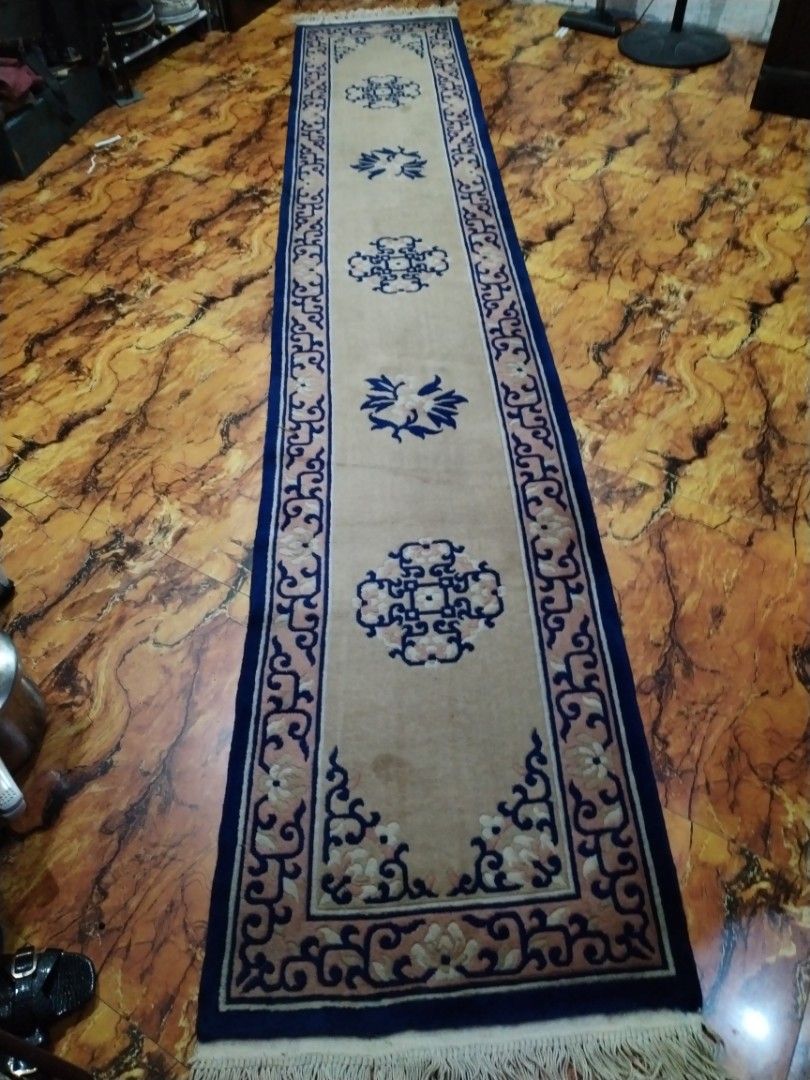 Long Oriental Runner Rug with Blue and Beige Pattern (Category: Carpets, Mats & Flooring) located in Caloocan City. Submitted by rowely_jpn (Listing ID 1449437021, Image 2). Description: Selling a long runner rug. Features a beige base with blue and pink floral patterns. Has a dark blue border and fringed ends. Great for hallways or entryways. Measures approximately 140 inches long. Good condition, some minor marks visible.japan surplus po ito..