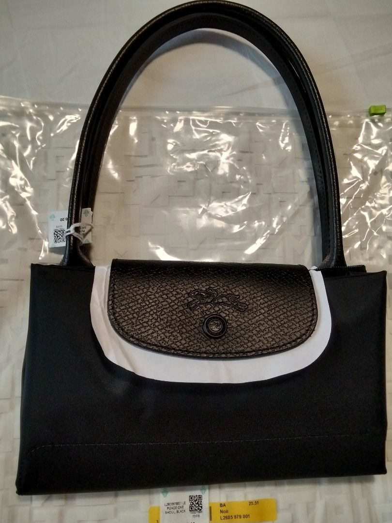Longchamp Le Pliage Shoulder Bag Black (Category: Luxury Bags & Wallets) located in Cainta. Submitted by roweb (Listing ID 1449425074, Image 2). Description: Longchamp Le Pliage One - Medium Long Handle - color Noir/Black - brand new, bought in Solaire, received as gift.