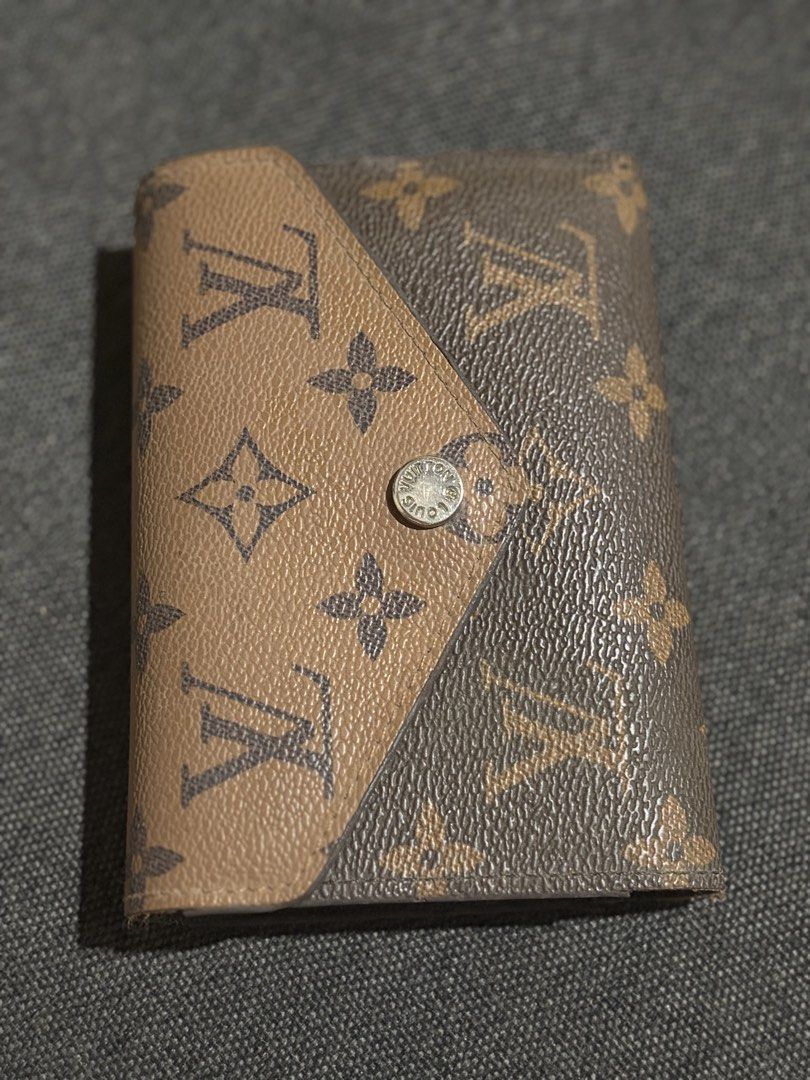 Louis Vuitton Monogram Canvas Trifold Wallet (Category: Luxury Bags & Wallets) located in San Jose del Monte. Submitted by dcrishop (Listing ID 1449498945, Image 1). Description: - Authentic Louis Vuitton wallet - Classic monogram canvas - Multiple card slots - Bill compartment - Secure snap closure - Shows some interior and edge wear (consistent with use) - Perfect for everyday carry.