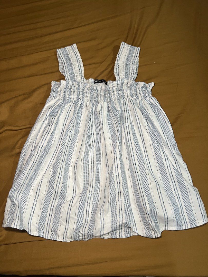 Lovito White Blue Striped Smocked Cami Top (Category: Sleeveless) located in Manila. Submitted by mzvmns (Listing ID 1449482692, Image 1). Description: BUNDLE!!! - Size Small to Medium - Once used -You can buy per piece - ₱100 per piece .