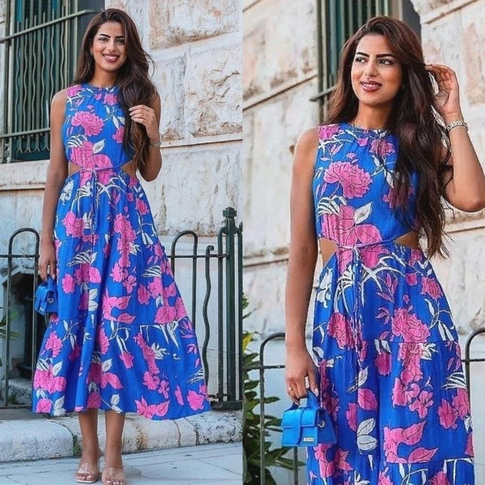 Mango Blue Floral Cutout Dress (Category: Dresses) located in Pagudpud. Submitted by altheacee063978 (Listing ID 1449389963, Image 1). Description: - fits s-m - Vibrant blue maxi dress - Bold pink floral print - Flattering cut-out details at the waist - Secure tie-back closure - Flowy tiered skirt for added movement - Sleeveless design - Ideal for summer outings or casual events.