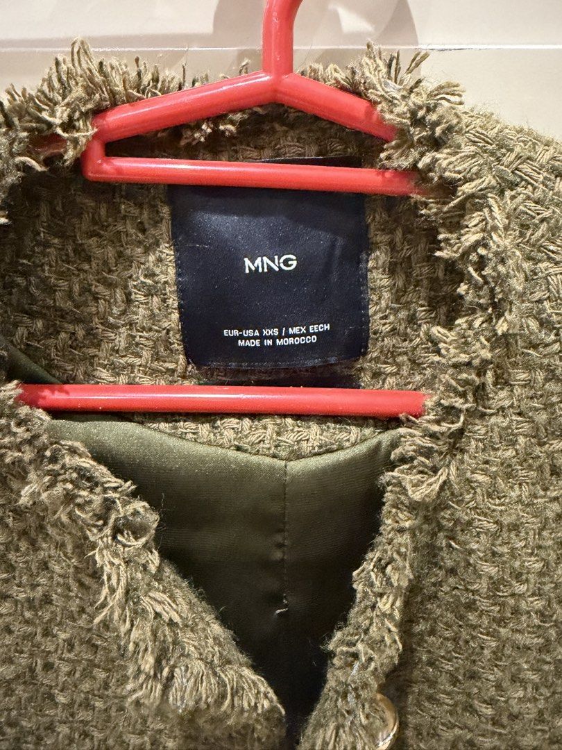 Mango Green Tweed Cropped Jacket with Gold Buttons (Category: Coats, Jackets and Outerwear) located in San Juan City. Submitted by closetsale28 (Listing ID 1449453728, Image 2). Description: - MNG Green Tweed Cropped Jacket - Frayed hem and cuffs for a trendy look - Four functional front pockets - Elegant gold button details - Fully lined for comfort - Proudly made in Morocco - Perfect for dressing up or down.
