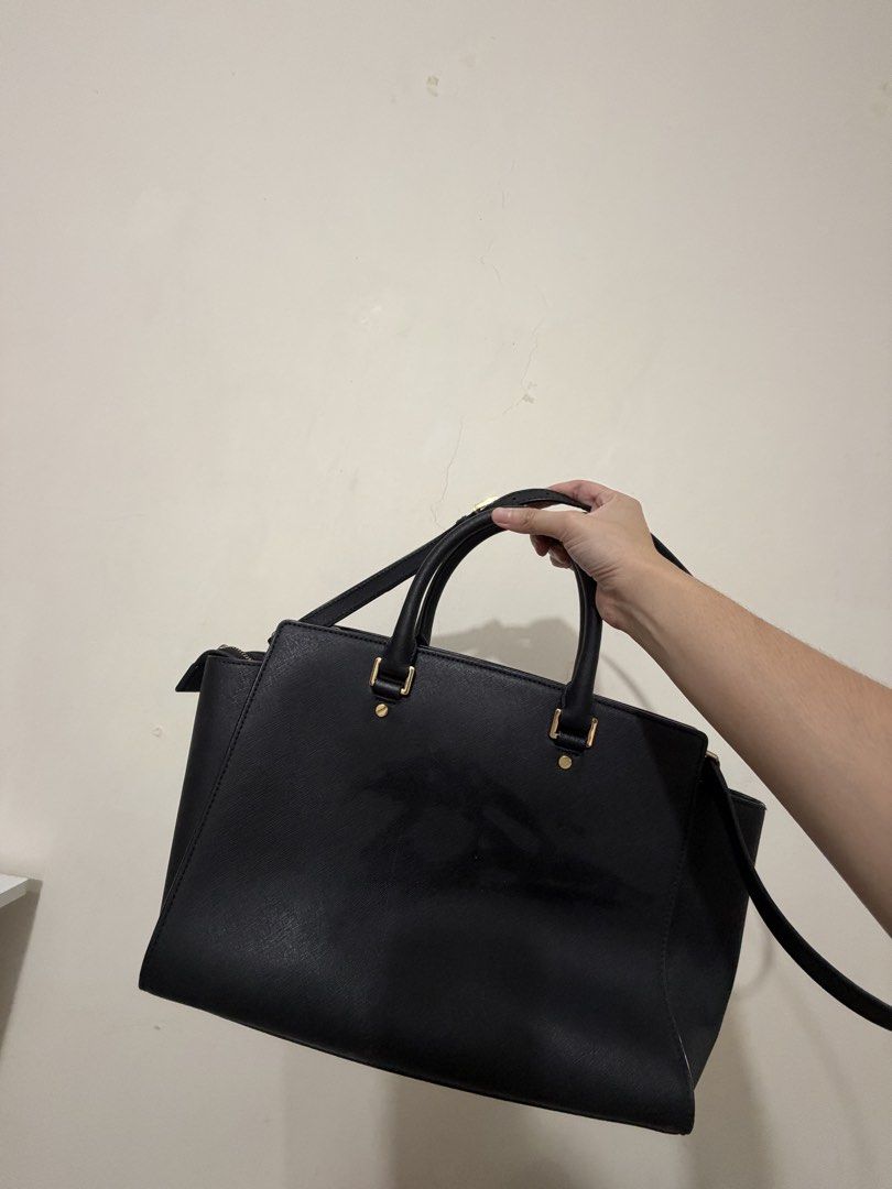 Michael Kors and Kate Spade bags (Category: Luxury Bags & Wallets) located in Manila. Submitted by declutteringbeee (Listing ID 1449480764, Image 2). Description: - Classic black Michael Kors tote bag - Genuine saffiano leather - Elegant gold hardware details - Ample interior space for essentials - Features top handles - Includes a detachable shoulder strap for versatile carrying - Ideal for work, school, or everyday errands - Interior is clean a