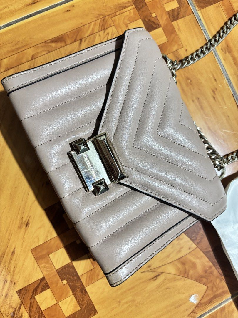 Michael Kors Quilted Leather Chain Shoulder Bag (Category: Luxury Bags & Wallets) located in Naic. Submitted by breyjon17 (Listing ID 1449444870, Image 2). Description: - Brand: Michael Kors - Color: Light Pink/Nude - Material: Quilted Chevron Leather - Hardware: Gold-tone - Closure: Turn-lock - Strap: Mixed Leather and Metal Chain - Includes: Original Dust Bag & Care Cards - Style: Perfect for going out or everyday use.