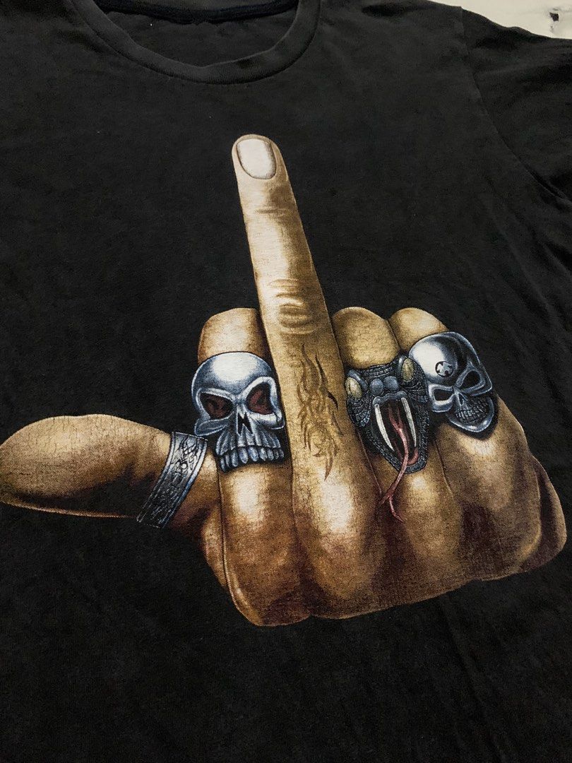 Middle Finger Skull Rings Graphic Print (Category: Tshirts & Polo Shirts ) located in Bulacan. Submitted by solsic (Listing ID 1449506909, Image 3). Description: No tags Pristine Print - Black t-shirt with striking graphic print on front and back. - Features a hand giving the middle finger, detailed with skull and snake rings. W: 19” L: 25” Small to Medium Well used, perfect for casual attire Issue: Mine: 450 plus SF Courier: J&T/Lalamove. Paymen