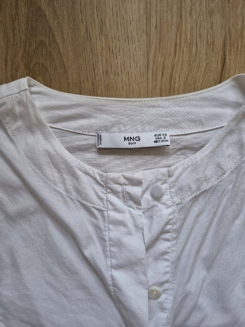 MNG White Lace Sleeve Button Up Blouse (Category: Blouses) located in Mandaluyong City. Submitted by _spike (Listing ID 1449414577, Image 3). Description: White button-up blouse from Mango Suit. Features delicate lace detailing on the sleeves. Long sleeves with button cuffs. Simple and classic design with a tropical twist. Size can go up to small and medium. Feel free to dm for more photos Payment methods: Gcash and Maya Shipping: Grab, Lalamove,