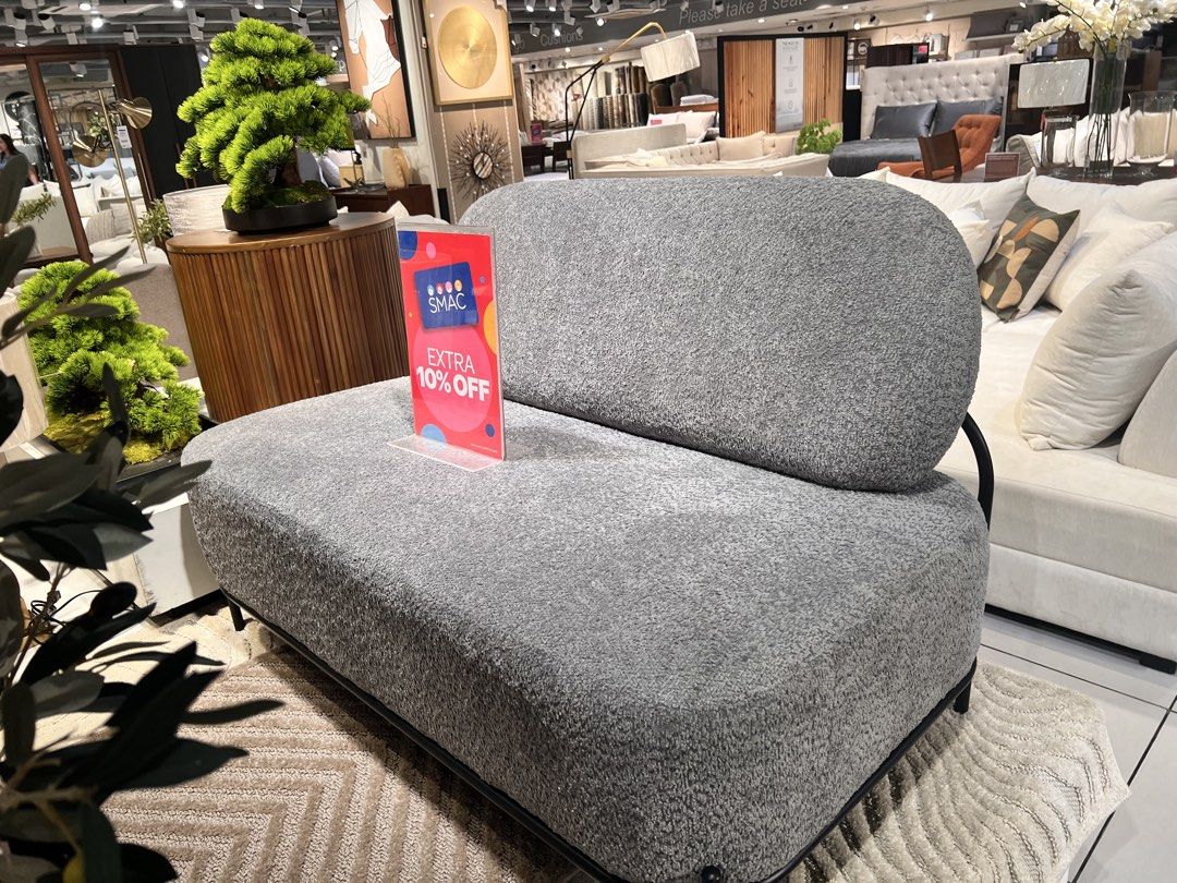 Modern Gray Boucle Sofa Mini 2-seater (Category: Sofas) located in Quezon City. Submitted by summerhues.co (Listing ID 1396717576, Image 2). Description: - Stylish gray boucle sofa - Modern design - Single-seat configuration with rounded back - Black metal frame - Includes a green textured pillow - Ideal for small apartments Location: QC Payment: Gcash or BPI Bought for 29,950 In great condition!.