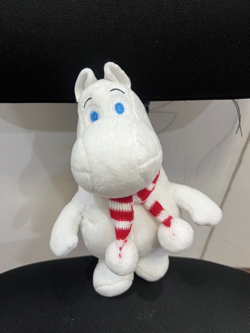 Moomin Plush Toy with Scarf (Category: Plushies & Soft Toys) located in Muntinlupa City. Submitted by goldinmygarage (Listing ID 1449486906, Image 1). Description: - Adorable Moomin plush toy - Features a cute red and white striped scarf - Super soft and cuddly material - Officially licensed Moomin Characters product - Approximately 20cm in height - Ideal gift for any Moomin enthusiast.