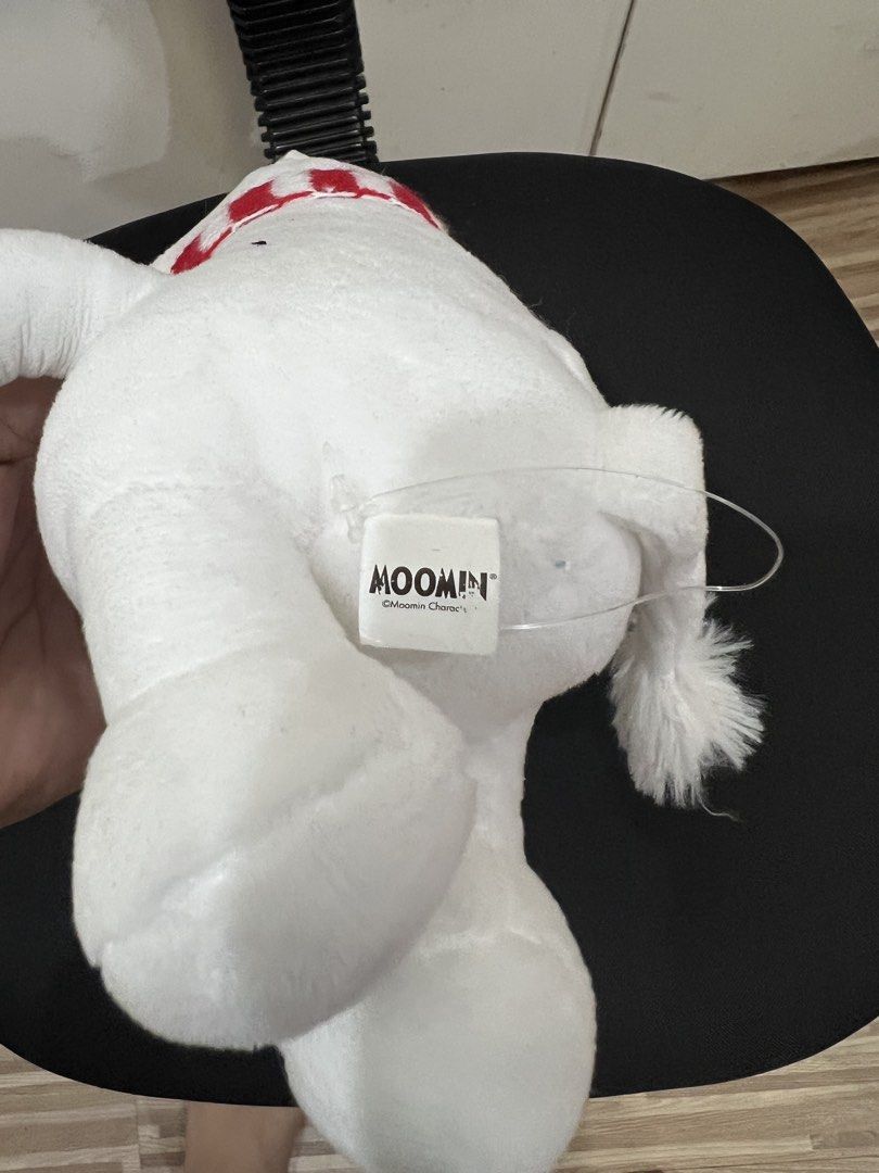 Moomin Plush Toy with Scarf (Category: Plushies & Soft Toys) located in Muntinlupa City. Submitted by goldinmygarage (Listing ID 1449486906, Image 3). Description: - Adorable Moomin plush toy - Features a cute red and white striped scarf - Super soft and cuddly material - Officially licensed Moomin Characters product - Approximately 20cm in height - Ideal gift for any Moomin enthusiast.