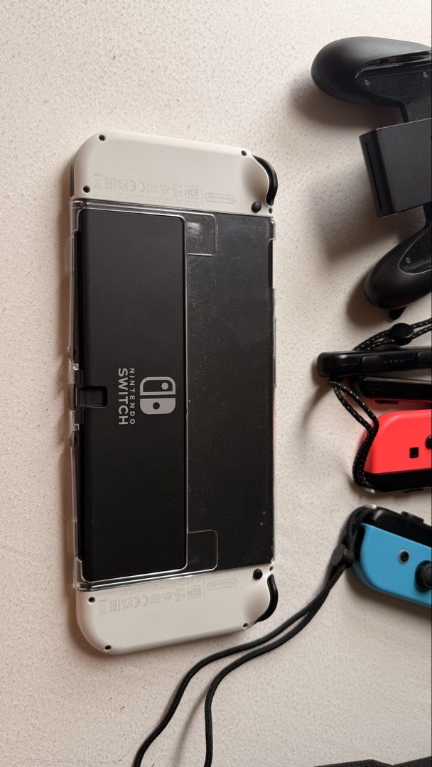 Nintendo Switch OLED 64 gb (Category: Nintendo) located in Makati City. Submitted by mdcb___ (Listing ID 1449394609, Image 3). Description: Gifted. Barely used. Maybe only 2 weeks. Good as new. Not jailbroken. Complete and original accessories. 13,500, fixed price. Inclusions: 1 - Nintendo Switch™ console (OLED model)* (HEG-001) 2 - Joy-Con™ (L) (HAC-015) 3 - Joy-Con (R) (HAC-016) 4 - Joy-Con Straps (HAC-014) 5 - High Speed HDMI™ Cable (HEG-005) 