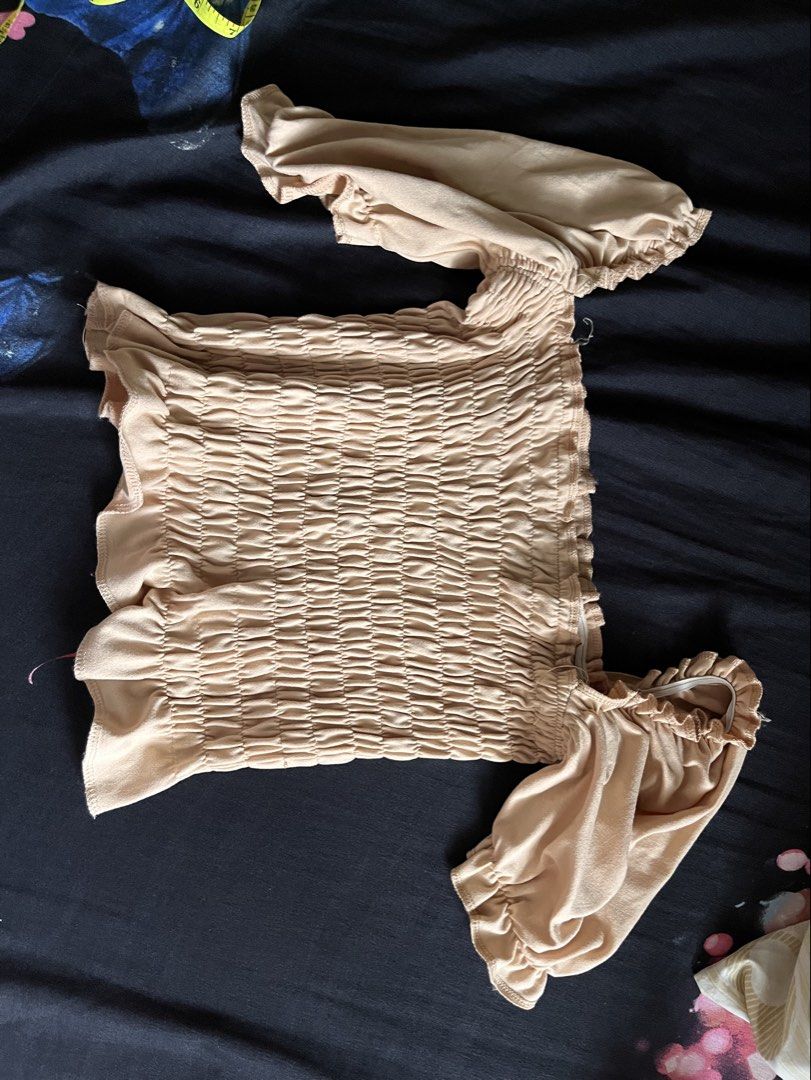 Off-Shoulder Smocked Crop Tops Bundle (Category: Others Tops) located in Valenzuela. Submitted by moorub21 (Listing ID 1449405499, Image 2). Description: - Bundle of 2 stylish crop tops - Maroon off-shoulder top with tie details (no issue) - Beige smocked off-shoulder top (Issue loose garter on chest part) - Versatile for casual outings or dressing up - Buy these with free white top - Bundle for 100 pesos.