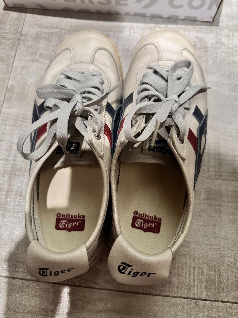 Onitsuka Tiger Sneakers (Category: Sneakers) located in Makati City. Submitted by robitusssinpapi (Listing ID 1449407568, Image 2). Description: - Classic Onitsuka Tiger sneakers - Color: White leather with navy and red stripe - Condition: Soles show some wear but retain good grip - Laces: Grey - Ideal for: Casual wear and everyday style Kasya sa 8 womens Negotiable.