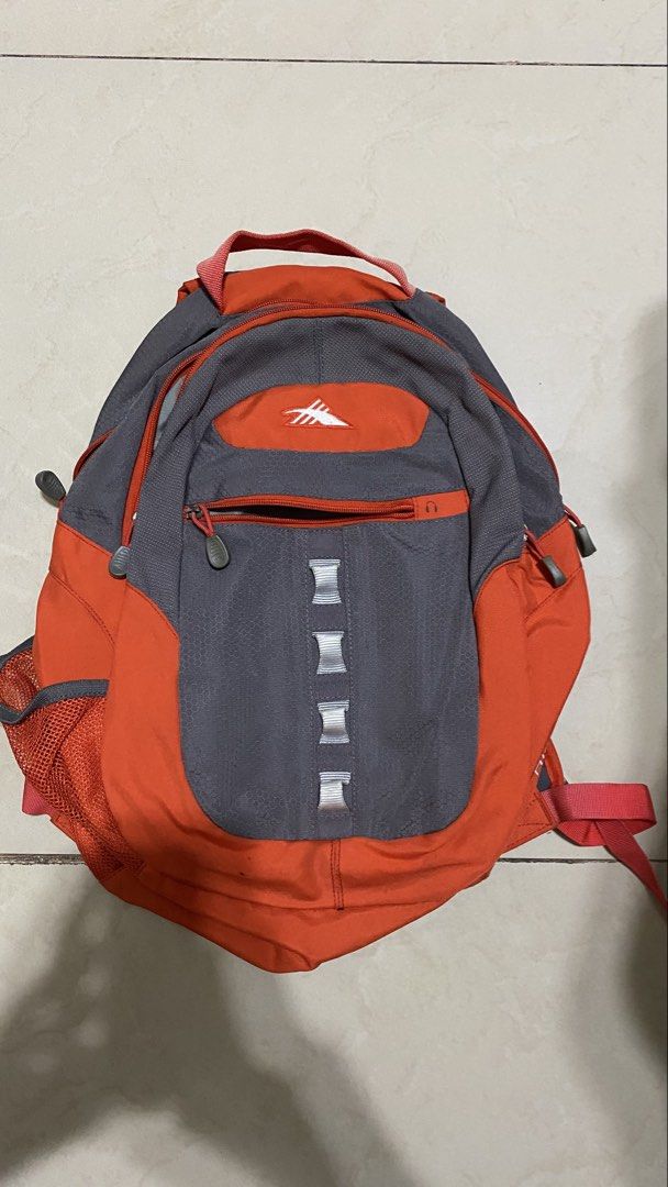 ORIGINAL HIGH SIERRA BACKPACK - ORANGE/ GRAY (Category: Backpacks) located in Quezon City. Submitted by deleondan (Listing ID 1449413855, Image 1). Description: Selling this original High Sierra backpack. Great for school, college, work, travel, or everyday use. Features: - Spacious main compartment - Multiple zippered compartments for organization - Side mesh pockets for water bottle - Adjustable padded shoulder straps - Durable and lightweight 