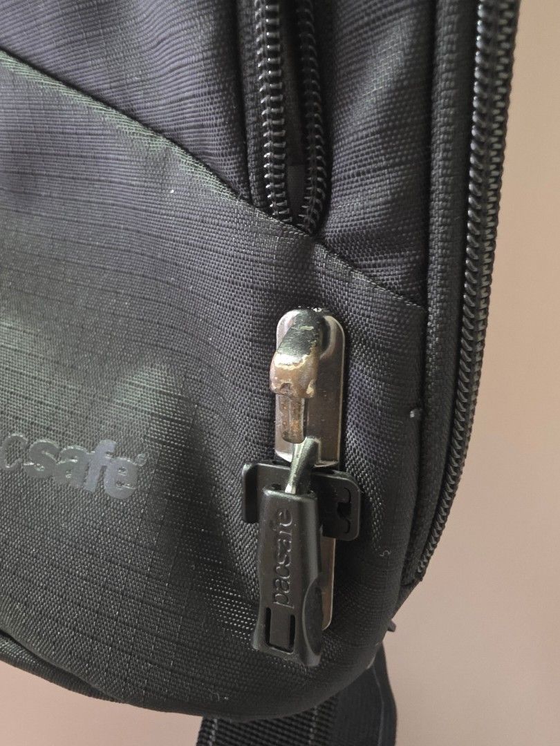 Pacsafe Vibe (Category: Belt bags, Clutches and Pouches) located in Manila. Submitted by tch_86 (Listing ID 1449365597, Image 3). Description: - Black color - Main zippered compartment - Front zippered pocket - RFID blocking technology for secure data protection - Slash-resistant materials for enhanced security - Adjustable strap for a comfortable fit - Perfect for travel and everyday use.
