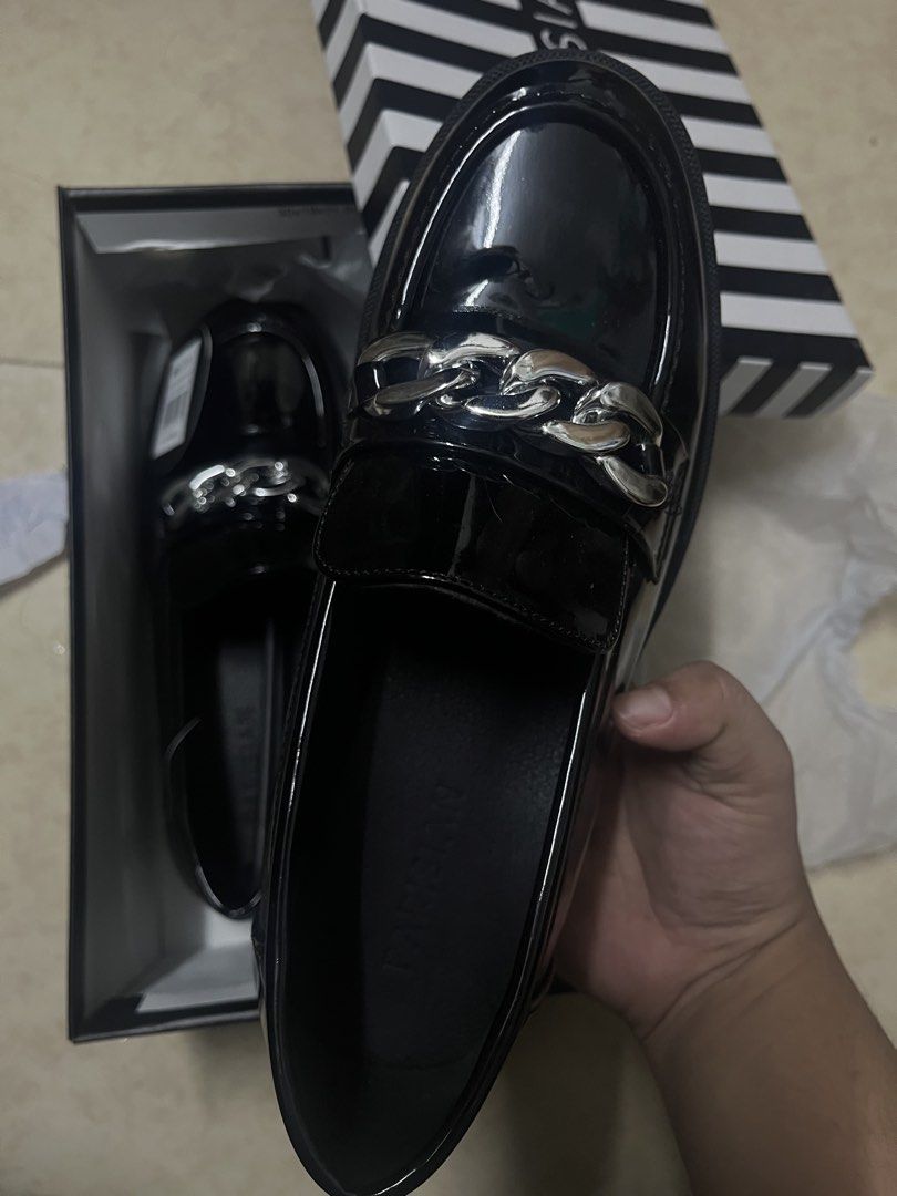 Parisian Black Chain Loafers (Category: Loafers) located in Manila. Submitted by curatednpreloved (Listing ID 1449417687, Image 3). Description: - Black loafers - Chunky sole with silver chain detail - Size: 8 US / 38 EUR - Includes original box - Tags still attached —————— - bought recently (July 5,2026) - bought for 1.3k - only worn it twice for an event - rfs: no longer needed 📍sampaloc, manila 🛵 lalamove.