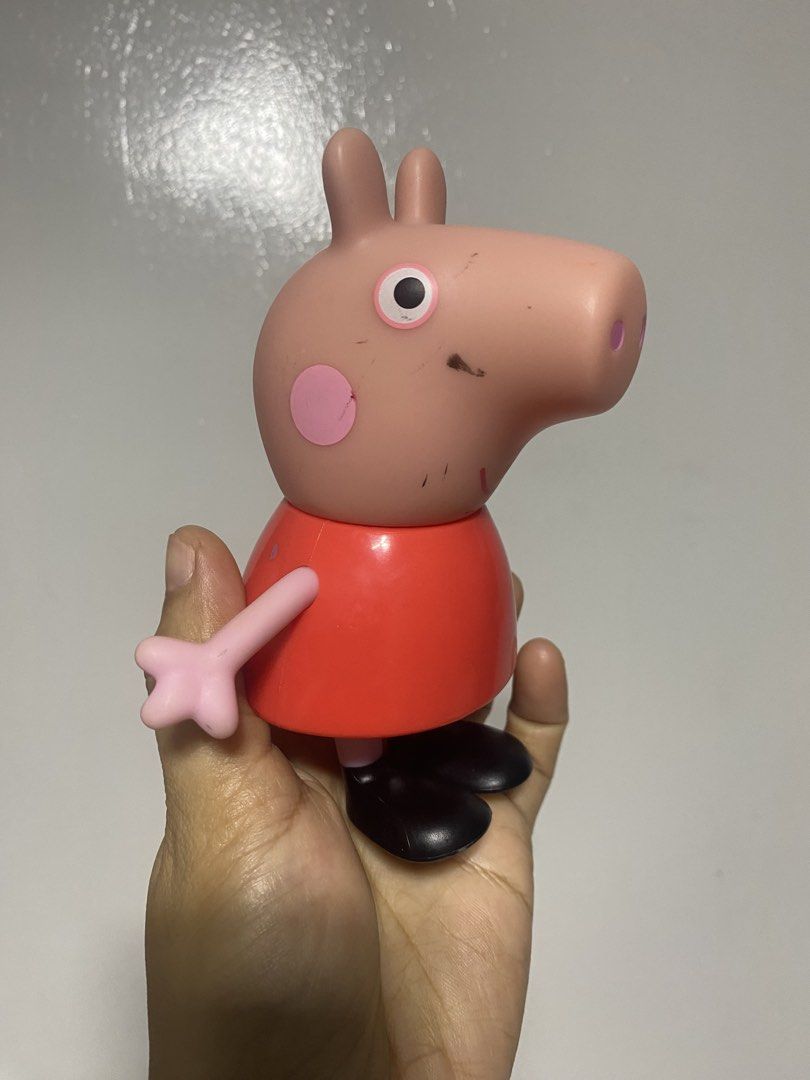 Peppa Pig Toy Figure Hasbro 2021 (Category: Figurines & Statues) located in Pasacao. Submitted by wengpullar37205 (Listing ID 1449505490, Image 2). Description: - Peppa Pig Toy Figure - Brand: Hasbro - Year: 2021 - Features: Signature red dress, black boots, movable arms - Condition: Minor scuffs on head and body - Ideal for: Any Peppa Pig fan.