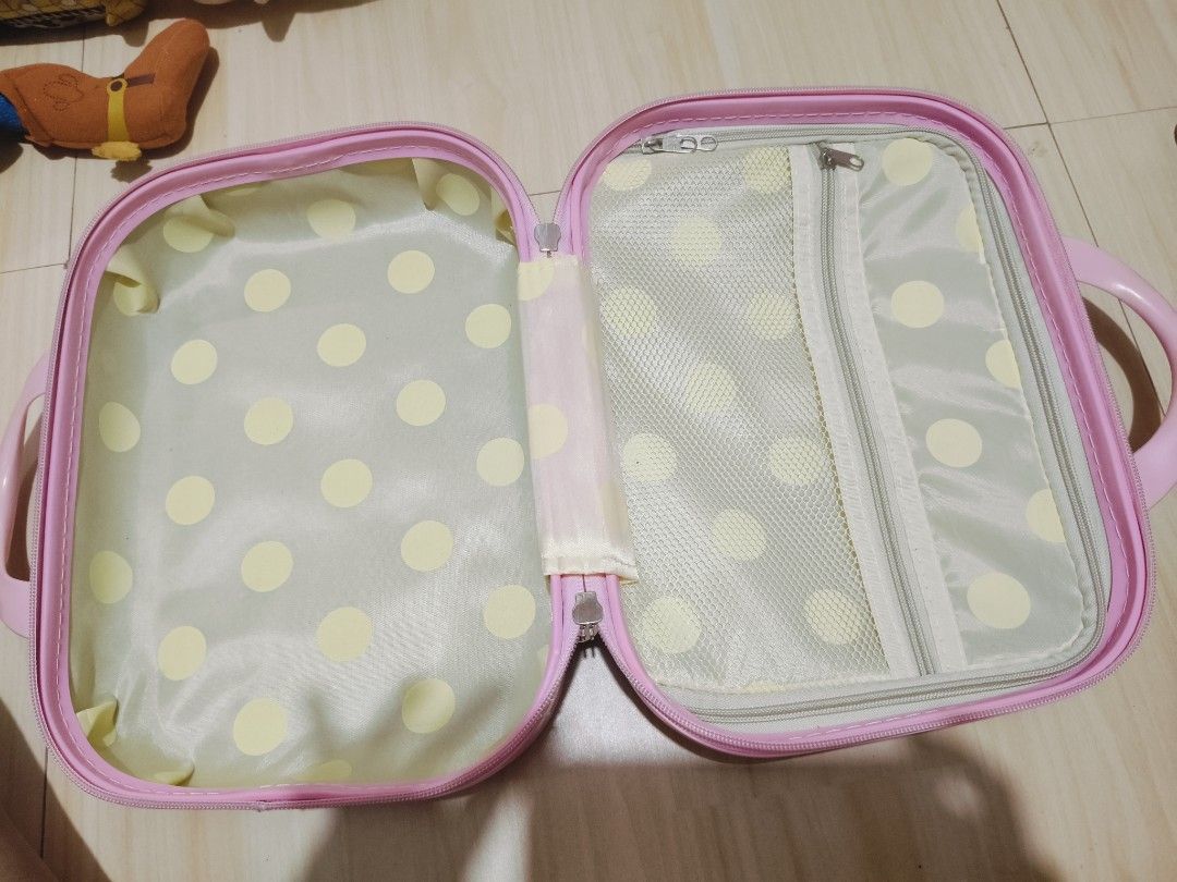 Pink Hello Kitty Vanity Case Travel Luggage (Category: Luxury Bags & Wallets) located in Pasay City. Submitted by annfelblairtogado (Listing ID 1449529017, Image 3). Description: - Adorable pink Kitty vanity case - Textured exterior with charming heart patterns - Fun polka dot interior lining - Ideal for storing makeup, toiletries, or travel essentials - Convenient top handle for easy carrying - Internal zipped compartment for organizing small it