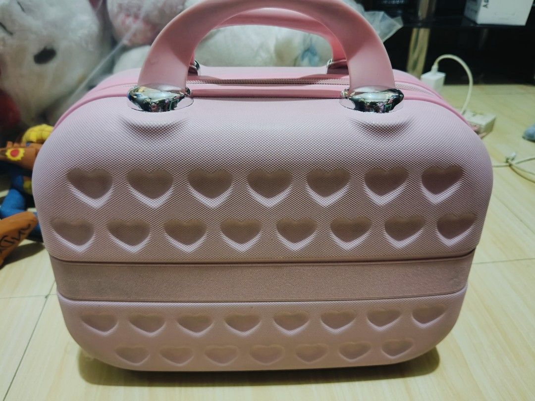 Pink Hello Kitty Vanity Case Travel Luggage (Category: Luxury Bags & Wallets) located in Pasay City. Submitted by annfelblairtogado (Listing ID 1449529017, Image 2). Description: - Adorable pink Kitty vanity case - Textured exterior with charming heart patterns - Fun polka dot interior lining - Ideal for storing makeup, toiletries, or travel essentials - Convenient top handle for easy carrying - Internal zipped compartment for organizing small it