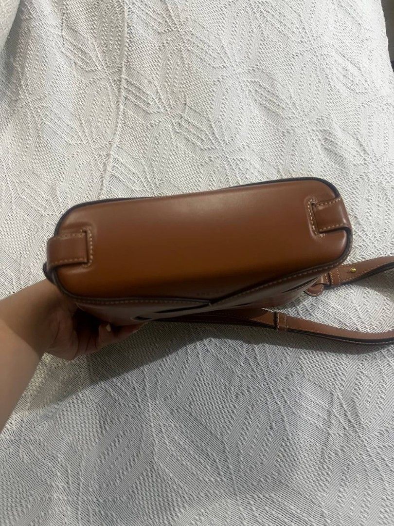 Polene Nodde Smooth Cognac (Category: Luxury Bags & Wallets) located in Calamba. Submitted by minabubu (Listing ID 1449386436, Image 3). Description: - Original Polene bag with dust bag - Lightly used (5x only) - With alcohol/oil stain inside (see photo) - Payment via GCash - Delivery via lalamove or go go express: SF shouldered by the buyer - RFS: decluttering .