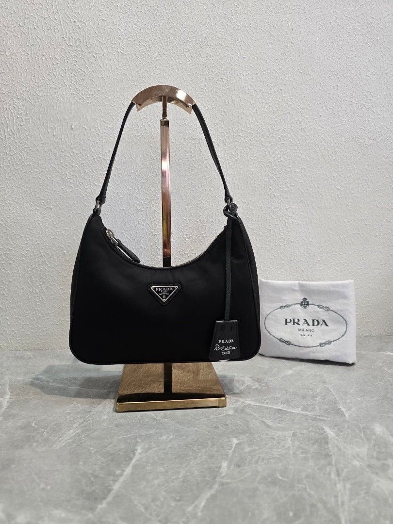 Prada Re-Edition 2005 Mini Shoulder Bag (Category: Luxury Bags & Wallets) located in Manila. Submitted by ej.collections (Listing ID 1449327475, Image 1). Description: NEGOTIABLE PRICE ALL ITEMS ARE ONHAND 💯 GUARANTEED AUTHENTIC MONEY BACK IF PROVEN FAKE •Size: Mini •Condition: In excellent condition/Rank A •Inclusions: Bag & dustbag •Plus shipping fee •Local & international shipment 📍Loc. Davao City.