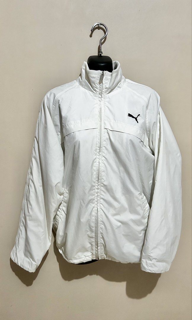 Puma White Track Jacket (Category: Coats, Jackets and Outerwear) located in Baliuag. Submitted by declutterbynadz (Listing ID 1448150129, Image 1). Description: - White Puma track jacket - Zip-up front with stand-up collar - Two front pockets - Puma logo on chest - Stripes on sleeves - Ideal for casual wear or sports .