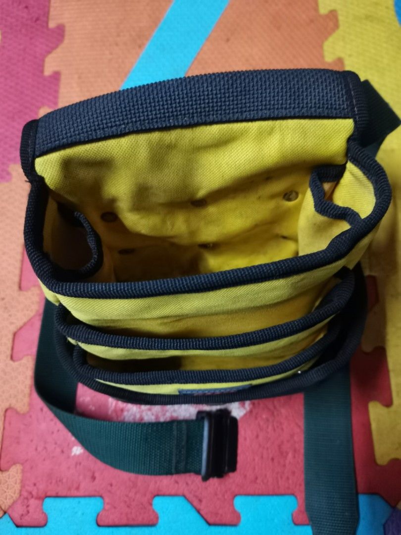 Roots Yellow Black Tool Bag Pouch with Strap (Category: Construction Tools & Equipment) located in Pasay City. Submitted by redivhan (Listing ID 1449340535, Image 2). Description: - Roots tool bag in vibrant yellow and black. - Features multiple internal compartments for excellent tool organization. - Includes an adjustable strap for comfortable carrying. - Ideal for mechanics, DIY enthusiasts, or anyone needing to carry essentials. - Shows some 
