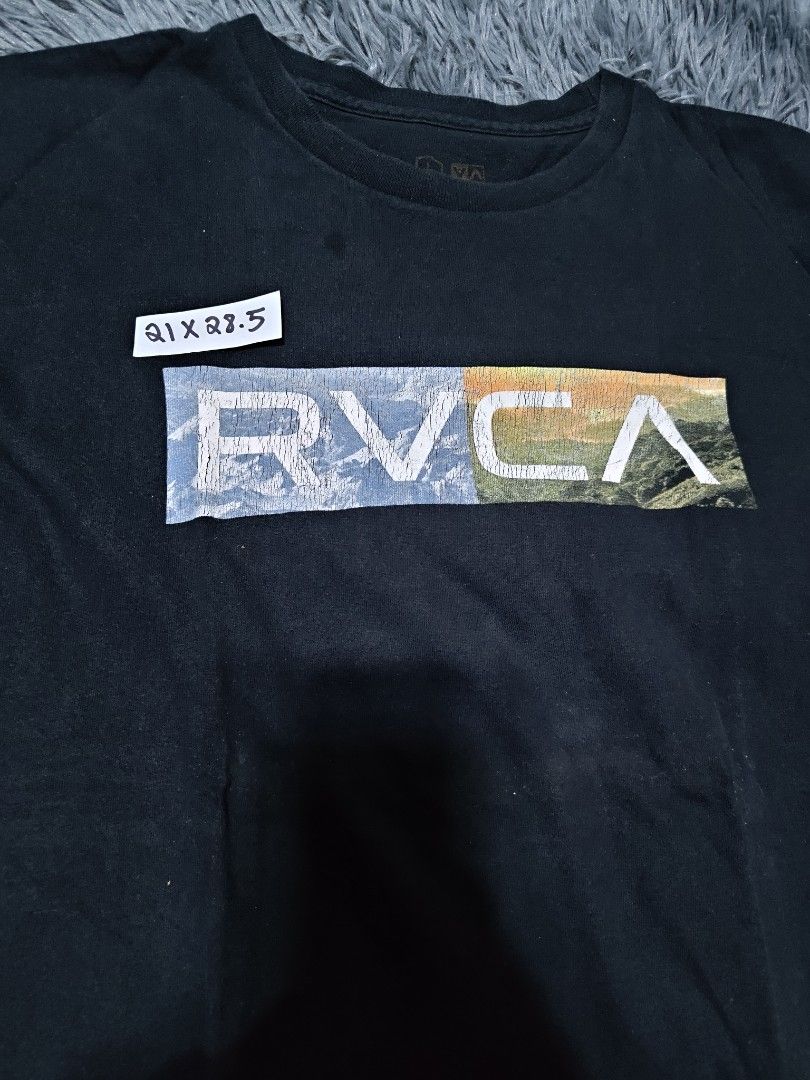 RVCA Black T-Shirt with Graphic Logo (Category: Tshirts & Polo Shirts ) located in Manila. Submitted by 3mvalkayrie (Listing ID 1449459212, Image 3). Description: - Brand: RVCA - Color: Black - Size: L - Design: Colorful RVCA logo graphic on front - Material: Good quality - Occasion: Casual wear - Special Feature: Artist Network Program details on tag.