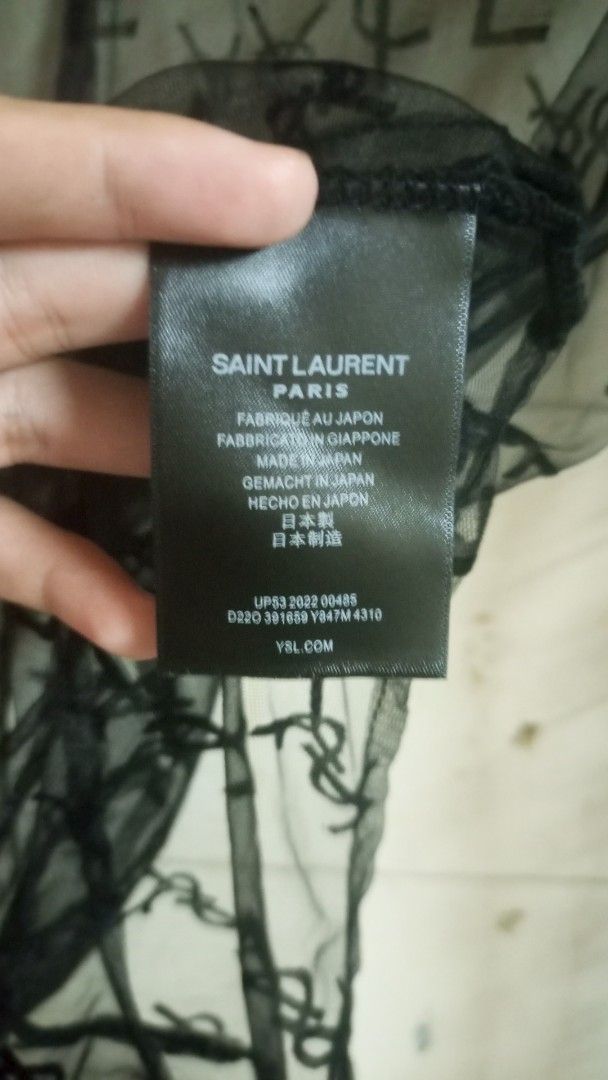 Saint Laurent Paris Black Lace Monogram Bodysuit (Category: Others Tops) located in Manila. Submitted by rizu09 (Listing ID 1449429894, Image 2). Description: - Authentic Saint Laurent Paris bodysuit - Features iconic YSL monogram all over in delicate lace - Long sleeves and a sophisticated high neck design - Made in Japan, ensuring quality craftsmanship - Size M - Comes with original tags, brand new.
