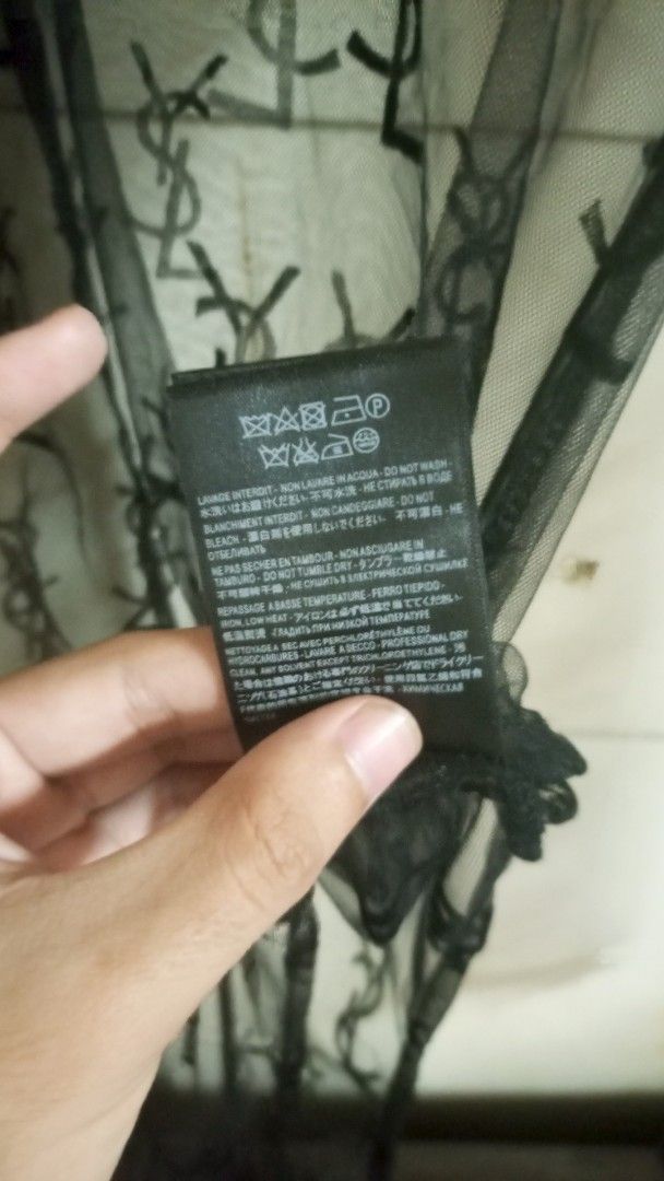 Saint Laurent Paris Black Lace Monogram Bodysuit (Category: Others Tops) located in Manila. Submitted by rizu09 (Listing ID 1449429894, Image 3). Description: - Authentic Saint Laurent Paris bodysuit - Features iconic YSL monogram all over in delicate lace - Long sleeves and a sophisticated high neck design - Made in Japan, ensuring quality craftsmanship - Size M - Comes with original tags, brand new.