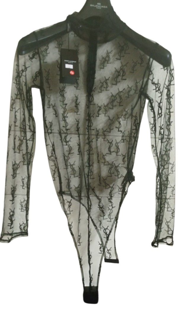 Saint Laurent Paris Black Lace Monogram Bodysuit (Category: Others Tops) located in Manila. Submitted by rizu09 (Listing ID 1449429894, Image 1). Description: - Authentic Saint Laurent Paris bodysuit - Features iconic YSL monogram all over in delicate lace - Long sleeves and a sophisticated high neck design - Made in Japan, ensuring quality craftsmanship - Size M - Comes with original tags, brand new.