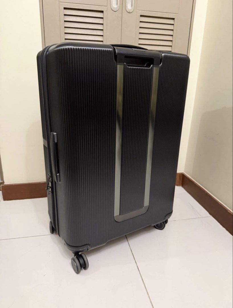 Samsonite Black Hardshell Spinner Luggage (Category: Luggage) located in Taguig. Submitted by bpambid (Listing ID 1449399411, Image 3). Description: - Brand: Samsonite - Color: Black - Type: Spinner Luggage - Exterior: Textured for durability - Security: TSA-approved combination lock - Mobility: Retractable handle and smooth-rolling wheels - Interior: Ample space for packing - Ideal for: Short trips and long vacations.
