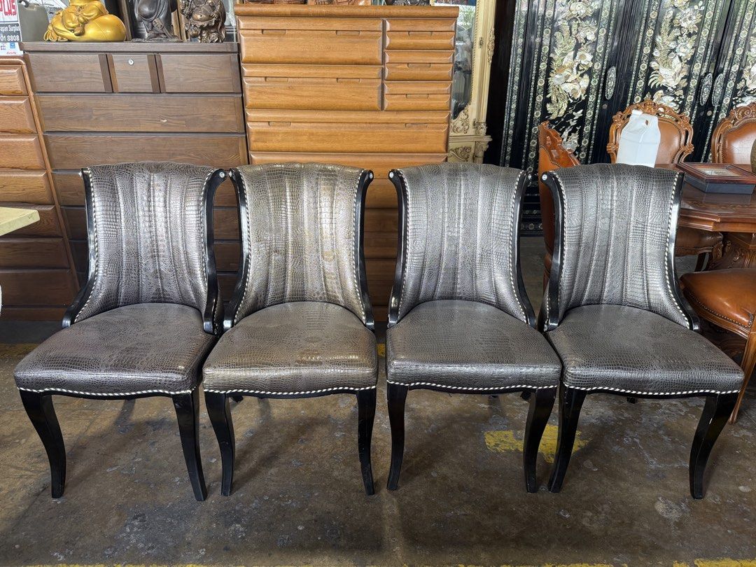 Set of 4 Crocodile Embossed Dining Chairs (Category: Chairs) located in Angeles City. Submitted by maryannmar33098 (Listing ID 1449525174, Image 1). Description: - Set of 4 unique dining chairs - Luxurious crocodile embossed upholstery - Sturdy dark wood frame - Elegant decorative nailhead trim - Comfortable curved backrest design - Versatile: Ideal for dining rooms or as stylish accent chairs ANNA LLANTO JAPAN SURPLUS .