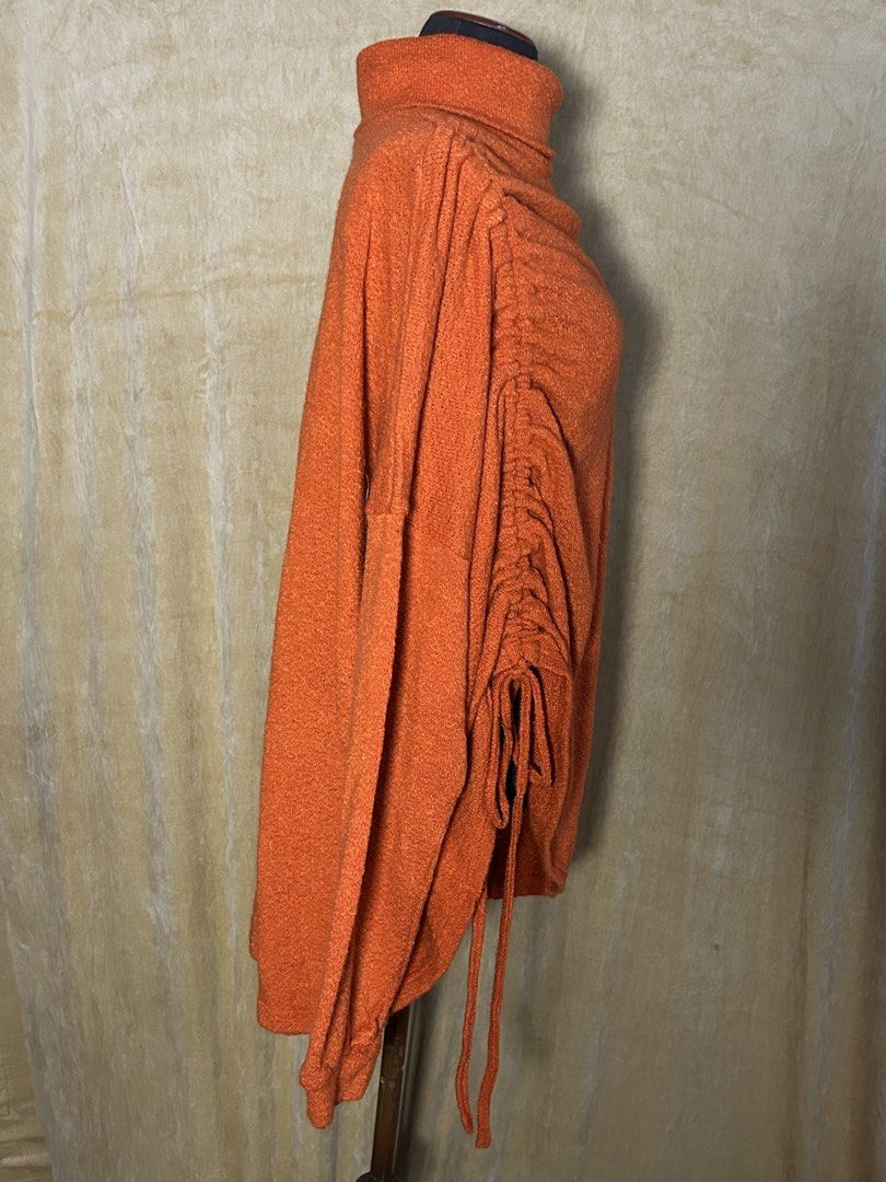 Shein Orange Turtleneck Sweater with Side Drawstring Detail (Category: Longsleeves) located in Batangas. Submitted by mkjgb (Listing ID 1449412120, Image 2). Description: Never been worn. Length from shoulder is 31”. Will fit up to XXL. - Cozy orange turtleneck sweater - Adjustable drawstring detail on one side - Stylish asymmetrical hem - Long sleeves - Comfortable, relaxed silhouette - Textured fabric for visual interest - Great for layering or