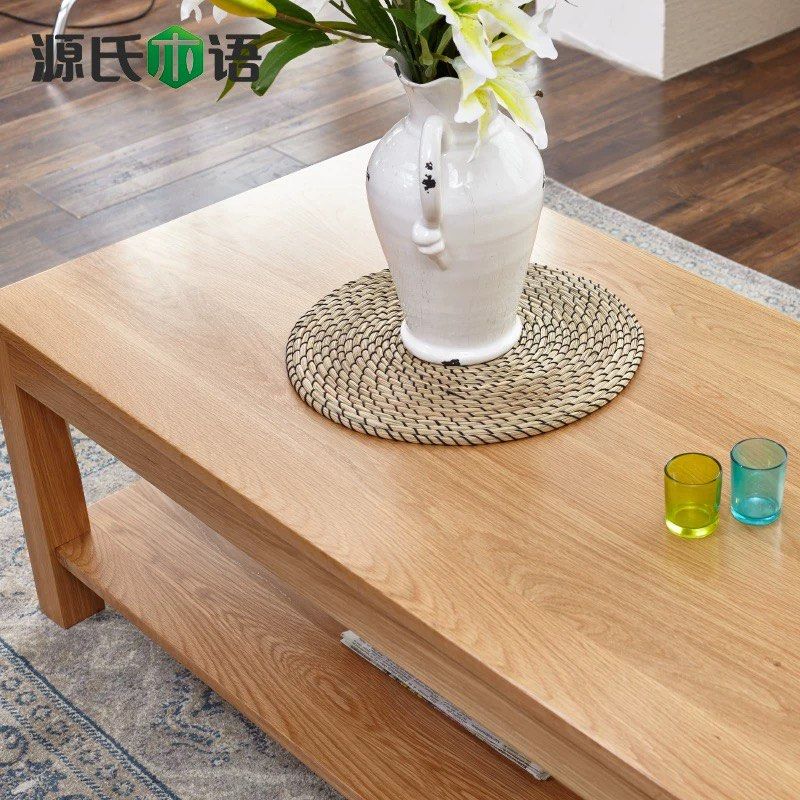 Solid Wood Table (Category: Tables & Sets) located in Singapore. Submitted by alex9401 (Listing ID 1449425222, Image 2). Description: - Solid wood coffee table - Natural oak color, solid US white oak - Features a lower shelf for extra storage - Dimensions: 1100mm (L) x 500mm (W) x 430mm (H) - Perfect for living rooms.