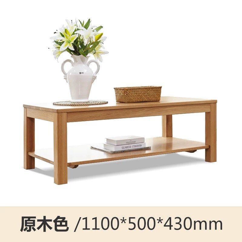 Solid Wood Table (Category: Tables & Sets) located in Singapore. Submitted by alex9401 (Listing ID 1449425222, Image 3). Description: - Solid wood coffee table - Natural oak color, solid US white oak - Features a lower shelf for extra storage - Dimensions: 1100mm (L) x 500mm (W) x 430mm (H) - Perfect for living rooms.