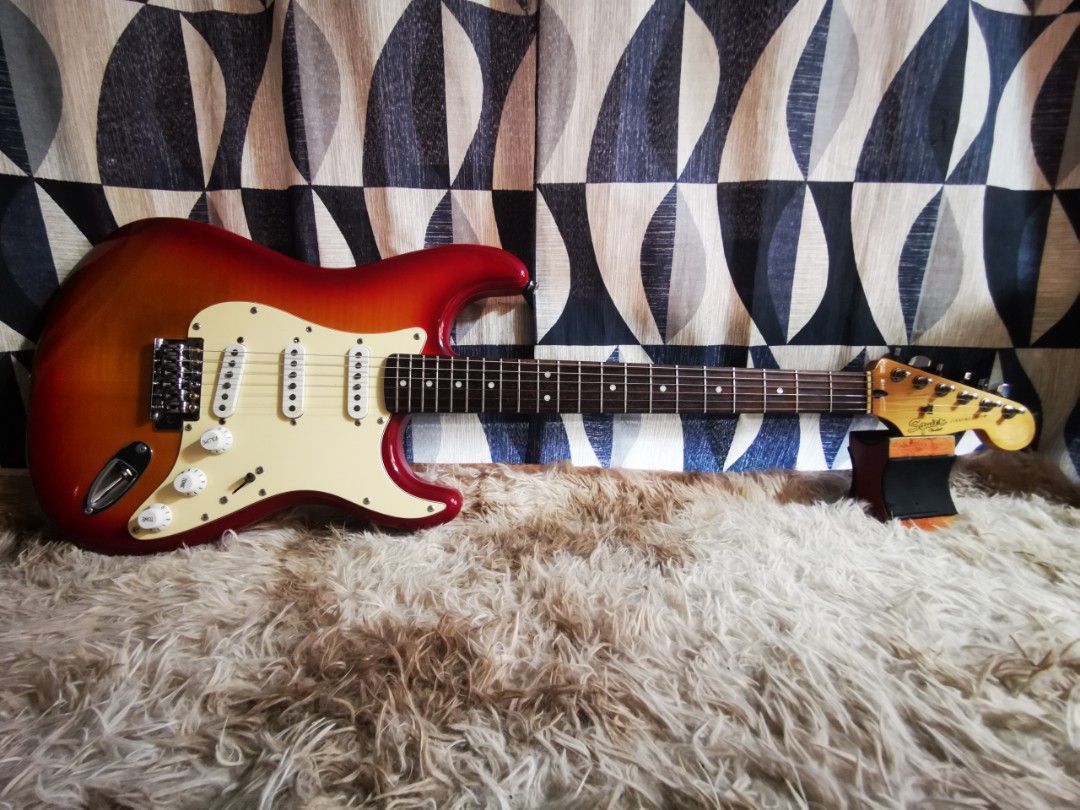 Squier Stratocaster Electric Guitar Sunburst (Category: Musical Instruments) located in Manila. Submitted by rickmon45 (Listing ID 1449521296, Image 1). Description: SQUIER SSS VINTAGE MODIFIED MODEL MADE IN INDIA RARE MODEL Prive 13000 - Squier Stratocaster electric guitar - Classic sunburst finish - Three single-coil pickups for versatile sound - Standard tremolo system - Rosewood fretboard with dot inlays - Chrome tuners - Ideal for beginners 