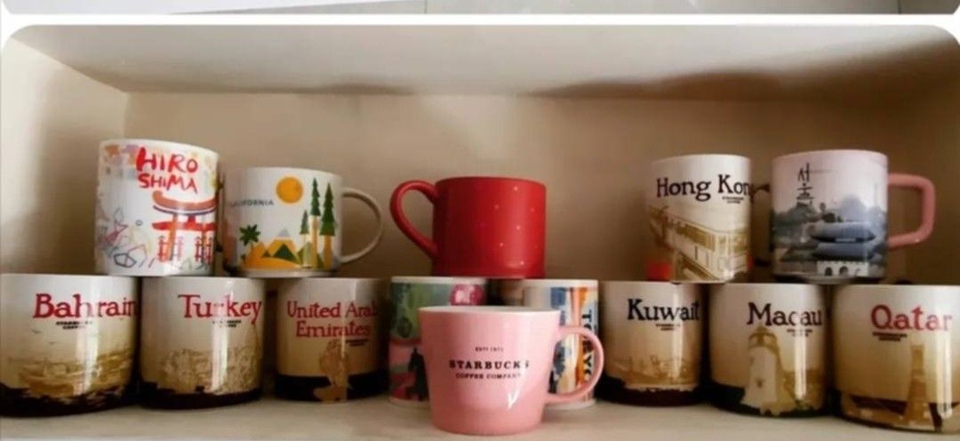 Starbucks City Collection Mugs (Category: Coffee & Tea Tableware) located in Mandaluyong City. Submitted by rsha31 (Listing ID 1449437203, Image 1). Description: - Collection of Starbucks City Mugs available. - Designs include: Hiro Shima, Bahrain, Turkey, United Arab Emirates, Hong Kong, Kuwait, Macau, Qatar. - Also includes a plain pink Starbucks mug and a red Starbucks mug. - Ideal for collectors and as unique souvenirs..