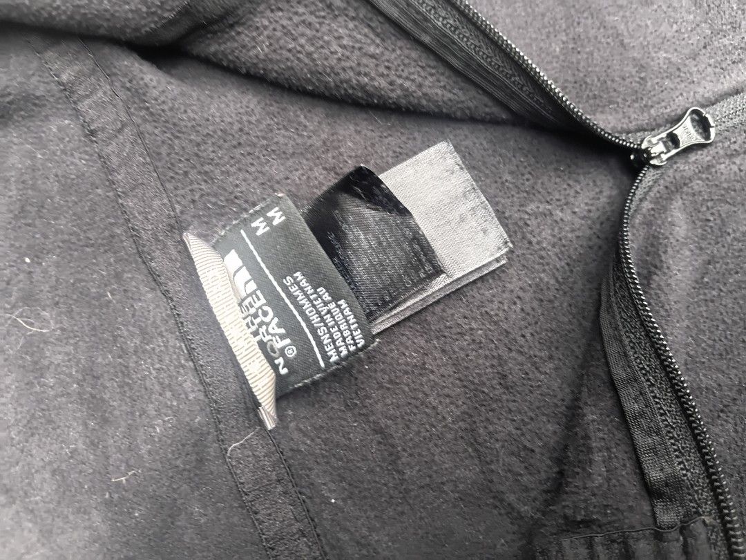 The North Face Fleece Pullover 1/4 Zip Men's Size M (Category: Coats, Jackets and Outerwear) located in Manila. Submitted by rollitgarments (Listing ID 1449428575, Image 3). Description: - The North Face Fleece Pullover - Men's Size M - Dark Grey Color - Quarter Zip Design - Made in Vietnam - Ideal for layering or casual wear - Please check photos for detailed condition.