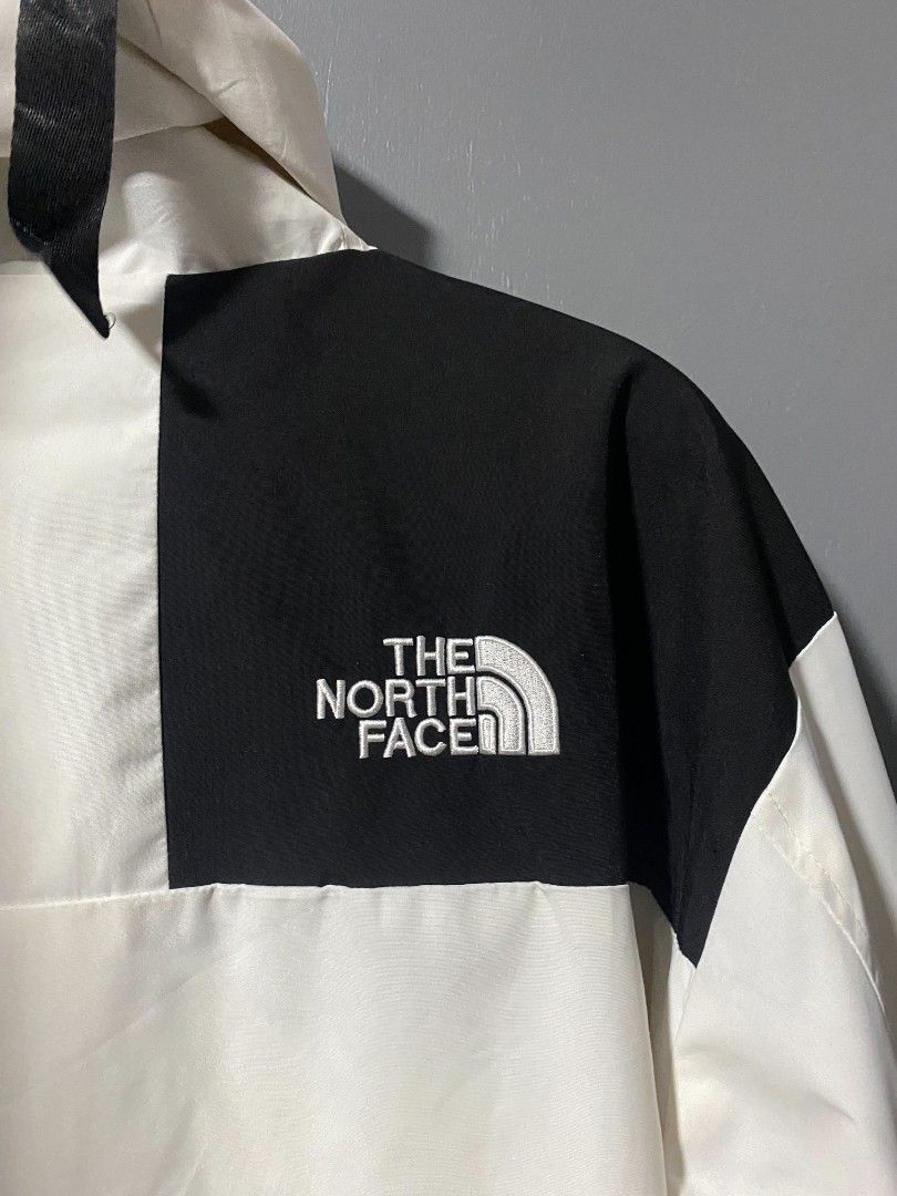 The North Face White and Black Colorblock Jacket (Category: Coats, Jackets and Outerwear) located in Tanay. Submitted by judevalcorza (Listing ID 1449393029, Image 3). Description: - Brand: The North Face Goretex - Color: White with Black Colorblock details on shoulders and sleeves - Size: 3XL - Features: Hooded design, drawstring hem - Ideal for: Outdoor activities and casual wear - Origin: Made in Bangladesh - Width 24 Lenght 28 - Honest Issue 